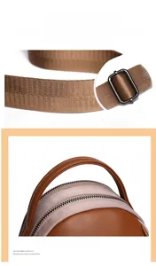Detail of adjustable brown striped wide shoulder strap and color-block leather handbag