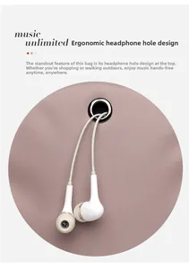 Close-up of the small handbag featuring a functional metal earphone hole and white cable