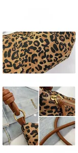 Close-up of leopard print fabric texture and premium gold hardware on the bag