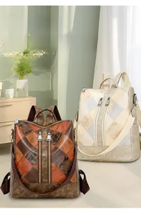 Detail of vintage patchwork leather backpack featuring dual vertical zipper closure design