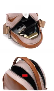 Detail view of the multi-compartment interior for small crossbody bag storage