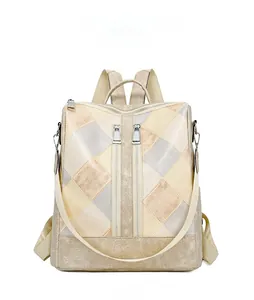Front view of quilted PU leather backpack with tricolor stitching and zipper accents