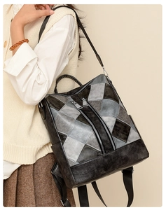 Detail of vintage patchwork faux leather backpack showing rhombus texture and metal zippers