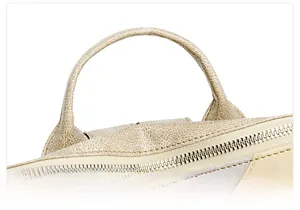 Detail of comfortable rounded top handle and metal zipper on PU leather backpack