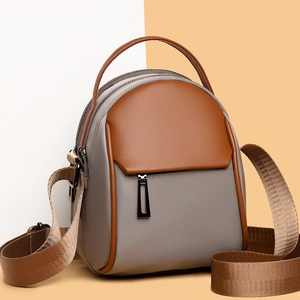 Minimalist grey and brown patchwork mini crossbody phone bag with adjustable strap