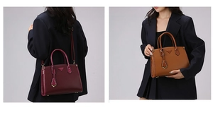 Detail of burgundy and tan tote bags with pebbled leather texture and metal logo