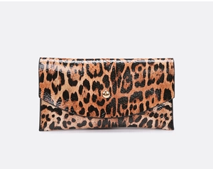 Close-up of leopard print envelope clutch bag with glossy finish and gold metal buckle