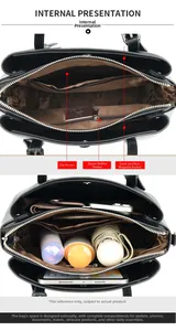 Detail view of the multi-compartment interior and brown lining of this black tote bag