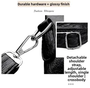 Detail of black pebbled leather bag with detachable silver metal hooks and strap