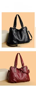 Close-up of quilted PU leather tote bag with metallic U-shaped handle ornaments