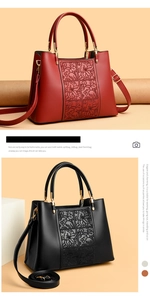 Detail of floral embossed texture on burgundy and black faux leather tote bags