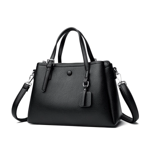 Classic black lychee pattern leather tote bag with top handles and adjustable shoulder strap