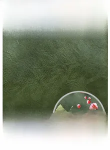 Detail of floral embroidery on green lychee pattern leather with a waterproof finish