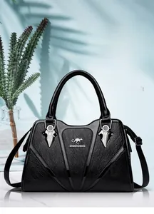 Detail of black pebbled leather tote bag with silver hardware and kangaroo logo accent