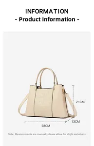 Detail view of beige embroidered handbag with floral relief and precise 28cm width dimensions