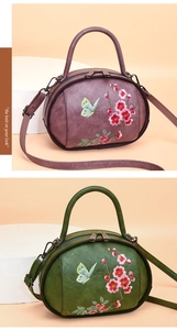 Detail of vintage flower embroidery on purple and dark green leather handbags