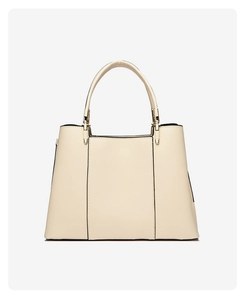 Detail of off-white embroidered handbag with premium golden hardware and smooth leather finish