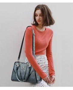 Detail view of water-resistant large tote bag with kangaroo logo and fine leather texture