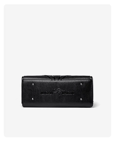 Detail view of black lychee leather bag base with silver studs and embossed logo