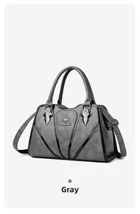 Detail of grey water-resistant tote with embossed texture and metal kangaroo logo