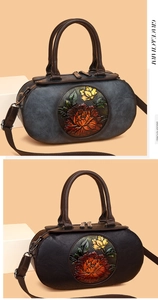 Close-up of vintage cylindrical handbag with 3D embossed peony and leather texture