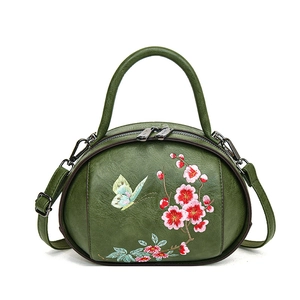 Retro dark green oval handbag with red plum blossom embroidery and top handle style