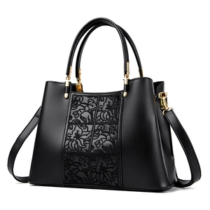 Elegant black embroidered handbag with floral relief patterns and gold hardware details