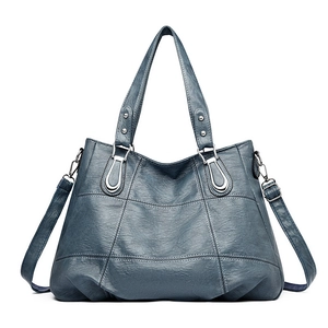 Large navy blue faux leather tote bag with white contrast stitching and silver hardware