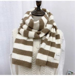 Close-up of brown and beige striped knit scarf texture and SEFZ SERVICE label detail