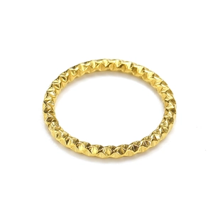 Minimalist gold titanium steel ring with diamond-cut sparkling texture on white background