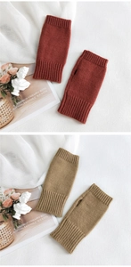 Detail of fingerless knit gloves showing thumb opening and ribbed cuffs in earthy tones