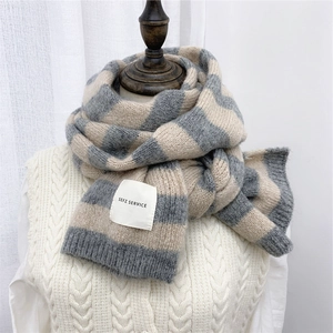 Thick striped knit scarf for women in grey and beige with decorative woven label