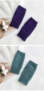 Detail view of purple and dark green knitted fingerless gloves with ribbed cuffs