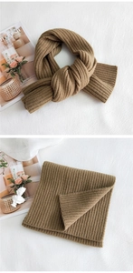 Detailed knit texture of thick camel striped scarf with ribbed weaving pattern