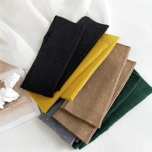 Winter knit fingerless gloves with sequins in black, yellow, camel, green, and grey
