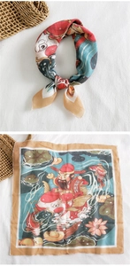 Detail of red festive square scarf showing God of Wealth and koi fish pattern