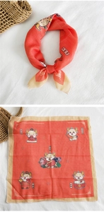Flat and knotted view of red cotton linen scarf with cartoon zodiac ox festive patterns