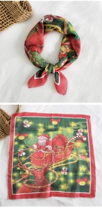 Detail of red Christmas cotton linen square scarf with Santa Claus and reindeer print