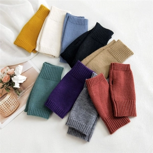 Colorful knitted fingerless gloves for women in various autumn colors with thumb hole