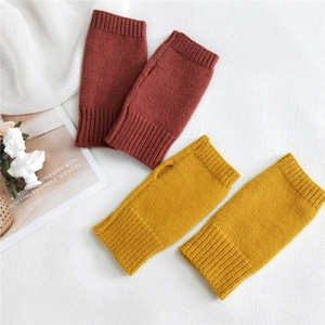 Minimalist solid color knitted fingerless gloves for winter with warm ribbed cuffs