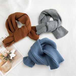 Vertical rib knit scarves in brown, gray and blue colors arranged on white background