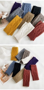 Detailed knit texture and color variety of cable knit fingerless arm warmers
