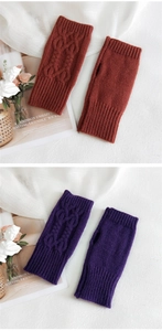 Detailed cable knit pattern on warm fingerless gloves in caramel red and deep purple