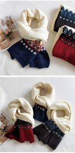 Close-up of Nordic Fair Isle jacquard knit scarf with thick ribbed edges and warm textures