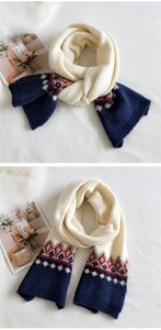 Detail of chunky knit scarf showing Nordic geometric patterns and soft texture