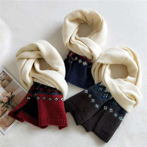 Thick knitted winter scarf with snowflake jacquard pattern in three color variations