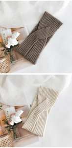 Detail of ribbed knit cross headband showing soft fabric texture and twisted design