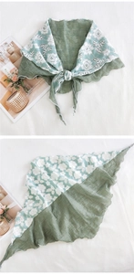 Detailed shot of Morandi green cotton linen triangle scarf with white floral lace trim