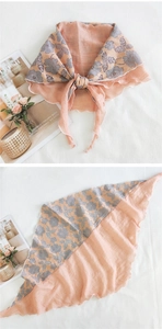 Detail of pink cotton linen triangle scarf with gray floral lace patchwork and wavy edges