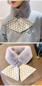 Detail view of plush knit scarf with grey diamond pattern and cross wrap design